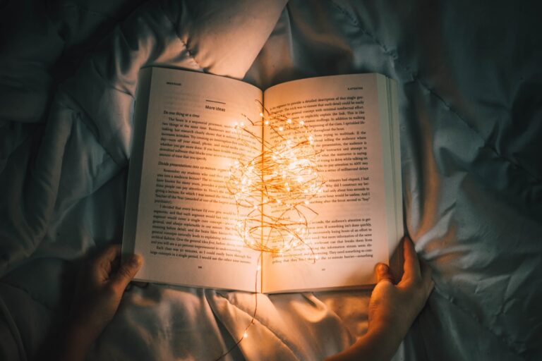 An open book with lights on it.